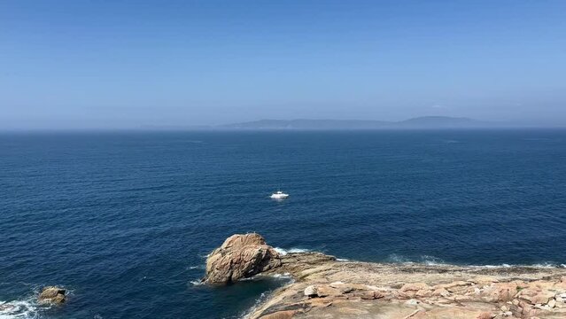 Atlantic ocean view, white fishing boat in the ocean, Relaxing, meditation background. Slow motion
