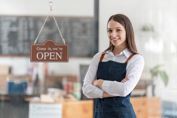 Startup successful small business owner sme beauty girl stand with tablet in coffee shop restaurant. Portrait of asian woman barista cafe owner. SME entrepreneur seller business concept