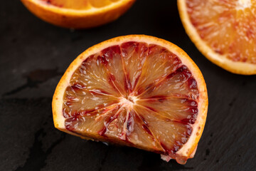 the red-orange flesh of an orange sliced in close-up