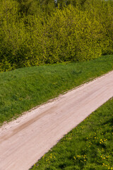 unpaved road in rural areas in spring, unpaved road