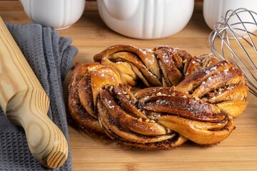 Roscón de reyes Kringle Estonia. Typical Christmas sweet, braided sponge cake with cinnamon, butter, walnuts or almonds and icing sugar.