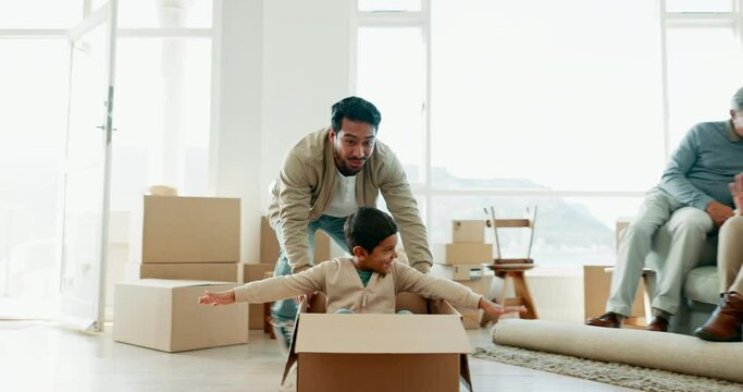Father, boy and push box in new home for airplane games, speed and happy with fun on floor. Dad, male child and cardboard package for car, race or playing together with love, bonding and family house