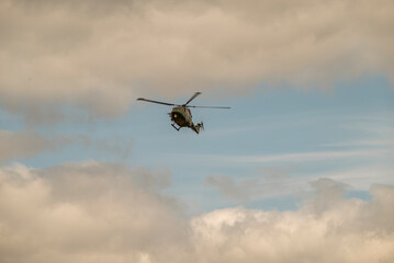 Fototapeta na wymiar helicopter flying in the air