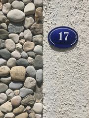 Close up of an house door number 17