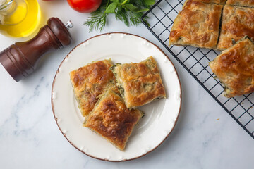 Greek cuisine; Spinach Tart or Spinach Pie. Turkish name; ispanakli borek or ispanakli tart