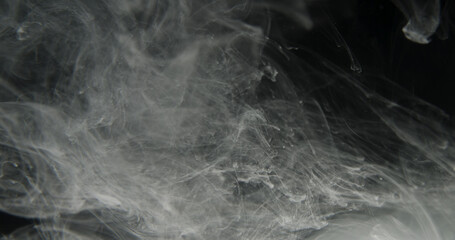 Black and white ink in water, smoke or fog