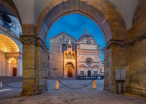 View Of Bergamo Cathedral Through The Arch At Dusk In Bergamo, Italy