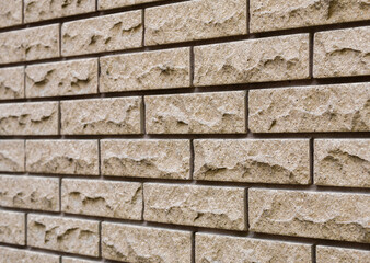 Angled view of the textured surface of clinker brickwork with deep seams