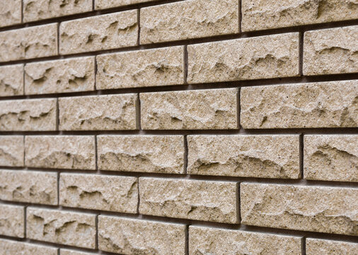 Angled view of the textured surface of clinker brickwork with deep seams