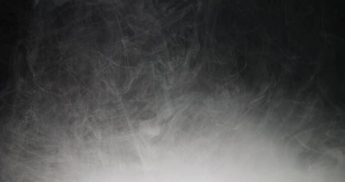 Black and white ink in water, smoke or fog