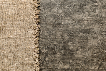 Old burlap fabric napkin, sackcloth on table background. top view with copy space