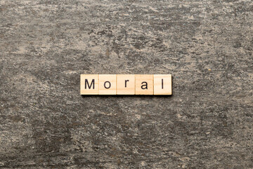 moral word written on wood block. moral text on table, concept