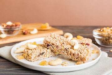 Various granola bars on table background. Cereal granola bars. Superfood breakfast bars with oats, nuts and berries, close up. Superfood concept