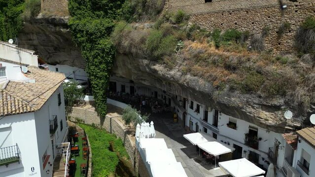 Buildings under a cliff in Setenil de Las Bodegas town in Andalusia, Spain