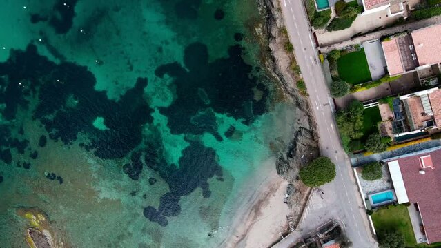 Aerial top down view of Port Lligat and the Mediterranean Sea along Costa Brava Catalonia Spain