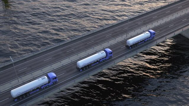 Convoy of generic electric semi trucks with hydrogen tank trailer driving along a bridge or coastal highway with wind turbines in background. Renewable energies concept. Realistic 3d animation.