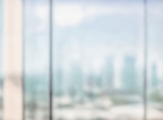 Blurred abstract glass wall from building in city town background.