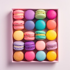 Obraz premium A box of tasty macaroons top view. Macaroons of rainbow colors laid out in a row.