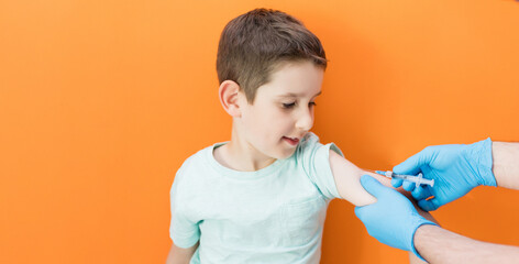 Vaccination concept on orange background