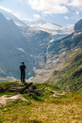 Fototapeta na wymiar hiker in front of Triftgletscher in June 2023 in Berner Oberland