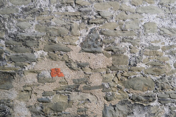beautiful vintage texture of the wall of a medieval castle built in the middle of the 14th century, multi-colored volumetric stones for the designer, wallpaper, background