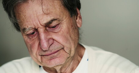 Fototapeta premium Older man suffering from depression portrait face closeup