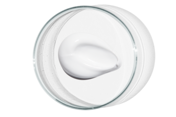 Petri dish isolated on empty background. A smear of cosmetic cream in a Petri dish.