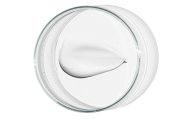 Petri dish isolated on empty background. A smear of cosmetic cream in a Petri dish.