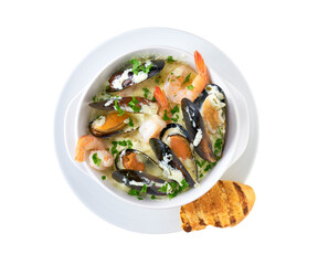 Delicious mediterranean seafood soup with mussels,prawns and toasted baguette isolated, top view.