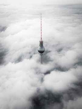 Aerial view of the television tower above the clouds, Berlin.