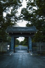 Entrance of a Japanese park with traditional Japanese gate. Japan in summer. Kyoto park