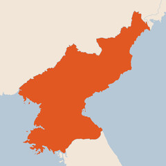 Map of the country of North Korea highlighted in orange isolated on a beige blue background