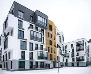 Cityscape of a residential area with modern apartment buildings on a bright winter day