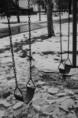 a frozen swing in the cold winter