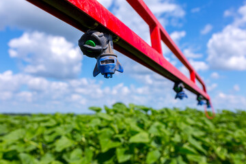 Sprinklers on the bracket of the plant protection sprayer preparing to spray a crop protection...