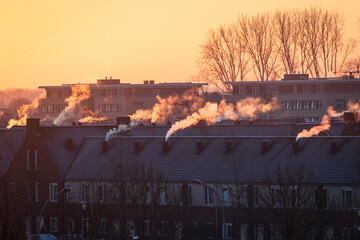 A roofscape in the Netherlands in winter, with homes being heated by natural gas