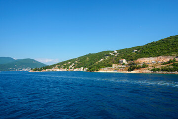 Naklejka na ściany i meble seascape during a voyage on a yacht in the Bay of Kotor, Montenegro, bright sunny day, mountains and sea, travel
