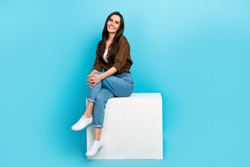 Full body length photo of sitting platform adorable model woman wear brown shirt denim jeans sit...
