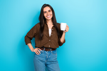 Photo of sweet shiny lady wear brown shirt enjoying coffee empty space isolated blue color background