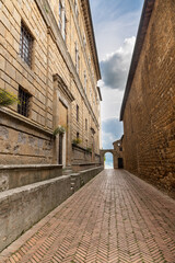 Narrow lane in the ancient town of Pienza in Tuscany, Italy