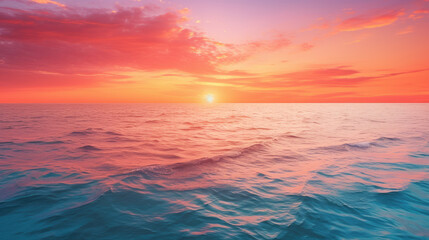Obraz premium At the horizon, as the sun sets, the sea gracefully meets the sky, accompanied by a gentle wave's embrace
