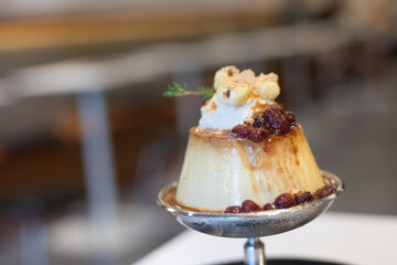 Pudding cake with sugar, cream and red beans on sliver cup