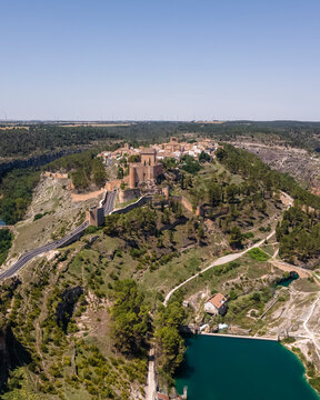 Aerial view of Alarcon, a medieval town with castle on top along the Rio Jucar river in Cuenca, Spain.