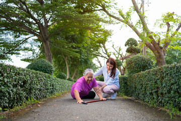 Asian senior woman fell down on lying floor because faint and limb weakness and Crying in pain form...