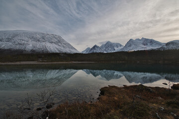 Panorama view and reflection of the Lake Aspevatnet in Svensby, Norway.