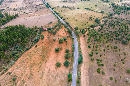 Aerial view of a road crossing the countryside along the Spanish and Portuguese border, Zebreira, Castel Branco, Portugal.