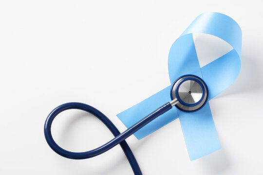 Blue ribbon with stethoscope on white background, prostate cancer awareness month, world diabetes day