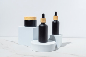Three cosmetic product mockups on geometric podiums. Background for presentation of cosmetic. Black bottles with bamboo lids