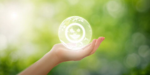 Hand holding earth with smiling face inside on blurred natural background, joy and care for the planet concept, promoting environmental happiness and connection with nature, sustainable world