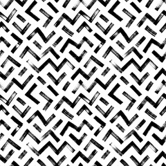 Seamless zigzag lines pattern. Brush drawn bold zig zag stripes. Geometric chevron abstract wallpaper. Tribal ethnic vector texture. Aztec geometric motif. Abstract modern ornament.